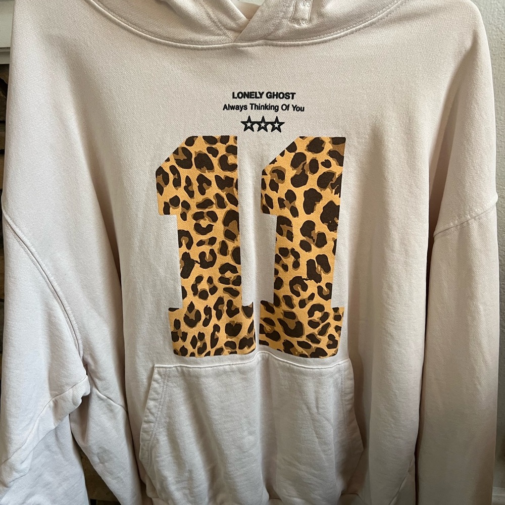 Lonely Ghost Cream Hoodie with Leopard Accents
